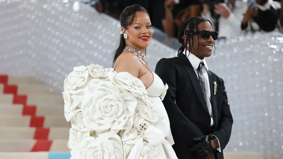 Rihanna and A$AP Rough posture for family photographs with new child